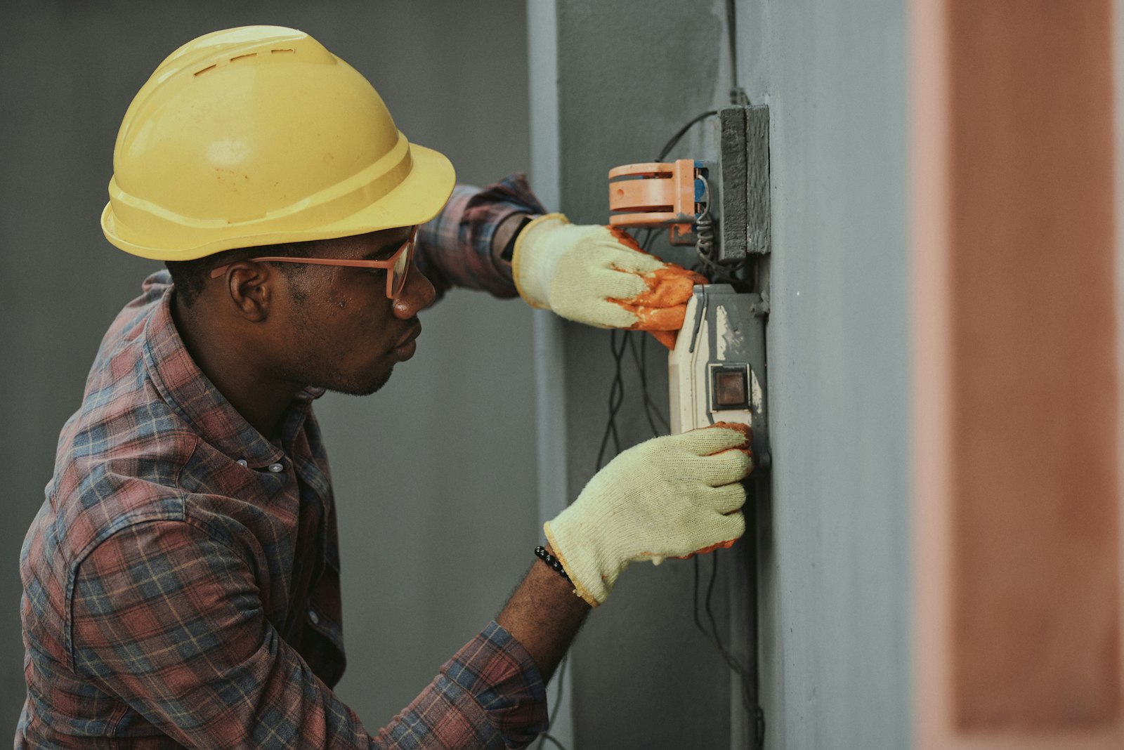 Professional electrician working on consumer unit